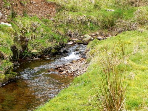 37.-Flowing-past-Twitchen-Ridge-2