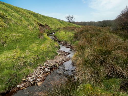 38.-Flowing-past-Twitchen-Ridge-2