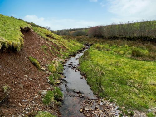 39.-Flowing-past-Twitchen-Ridge-2